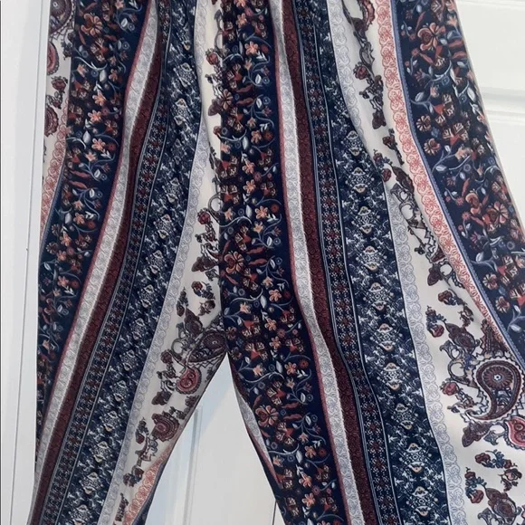 Elegant Blue and Cream Striped Jumpsuit with High Neckline - Picture 5 of 5